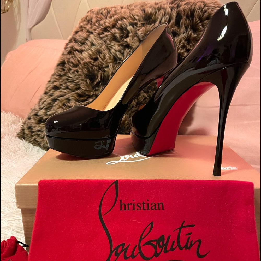 Black patent Christian Louboutin pumps